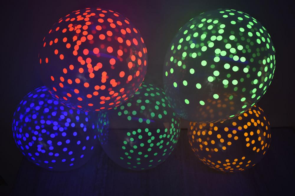 glow in the dark balloons with neon confetti